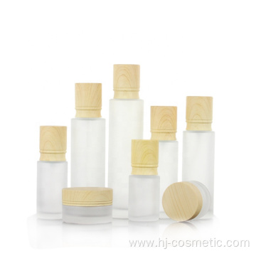 High-grade Cosmetic transparent Frosted glass bottles/jars with wood grain cap